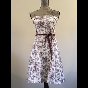 Small strapless ivory dress w/ brown floral design